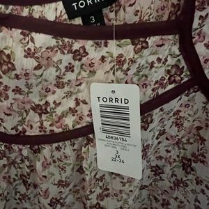 Torrid size 3 (3x) short sleve blouse.  Floral print. Slightly sheer.